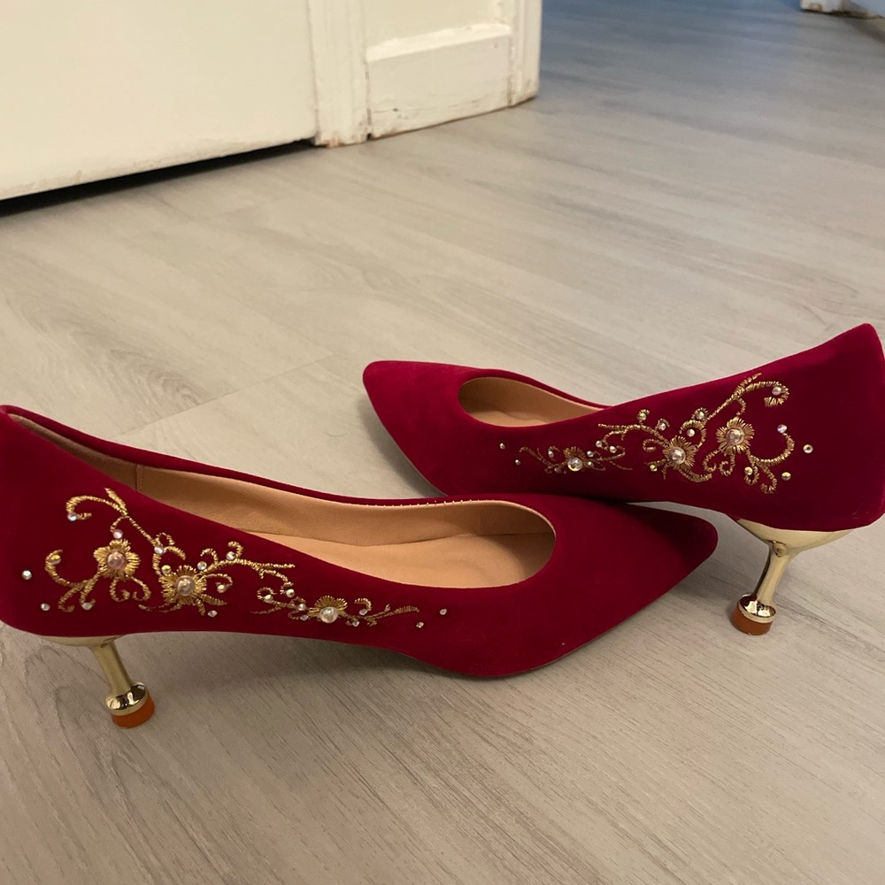 Red heels with gold detailing